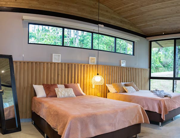 Crystal Cabin Cerro Azul surrounded by lush greenery 01