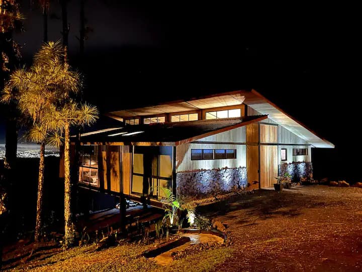 Crystal Cabin Cerro Azul surrounded by lush greenery 01